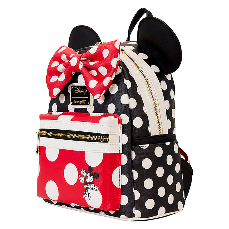 Polka dot backpack with red bow, black ears, and Minnie Mouse on a white background