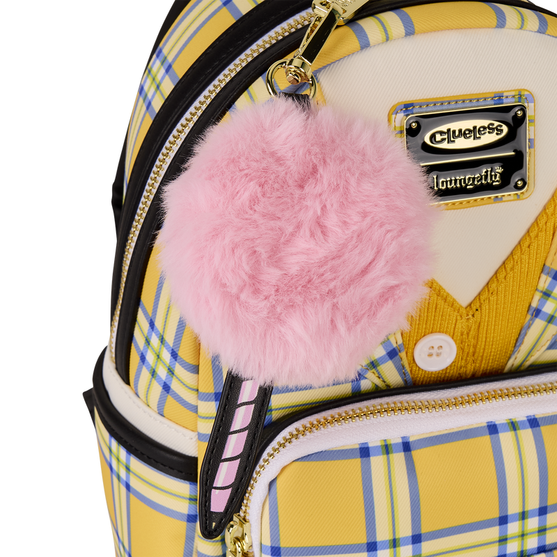 Backpack with pink fluffy keychain and 'Clueless' label on plaid pattern