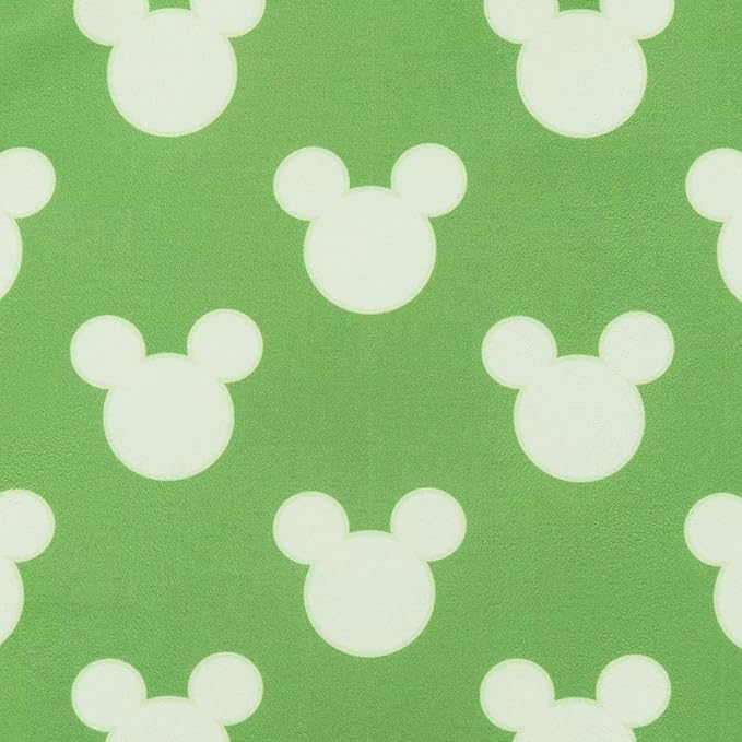 White Mickey Mouse ears pattern on a green background