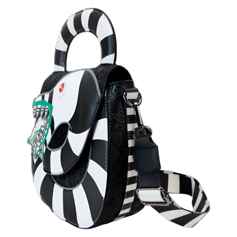 Side view of the black and white striped Beetlejuice Sandworm Crossbody Bag with picture of the sandworm's face on a white background