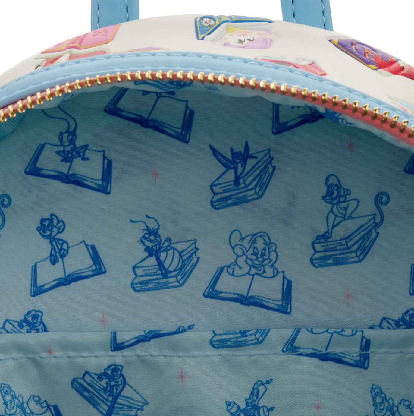 Close-up of a the inside of the bag with Disney character designs on a light blue background