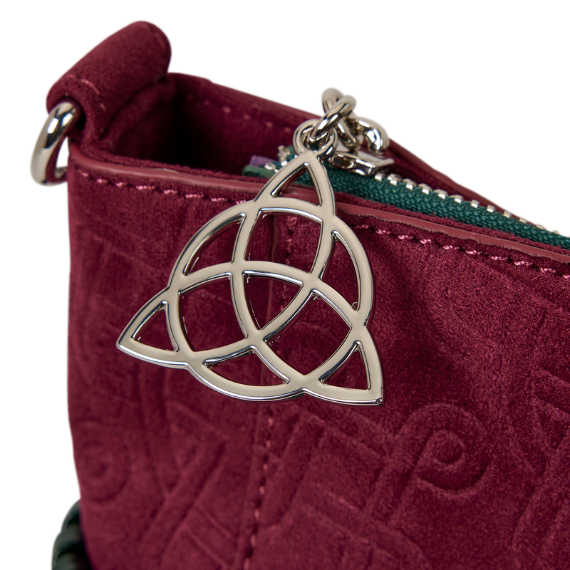 Maroon textured pouch with a silver Trinity knot charm on a white background