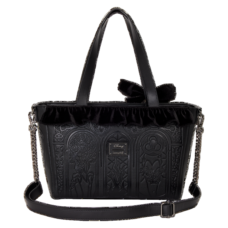 Black handbag with intricate designs and a bow on a white background