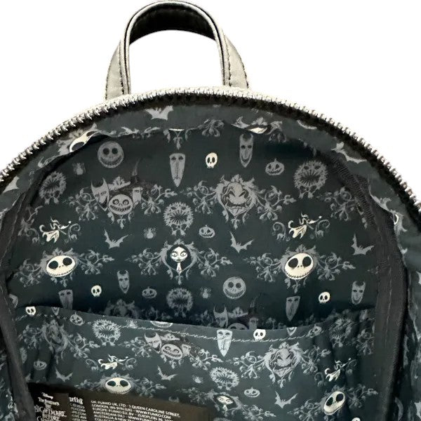 Backpack with a Halloween-themed pattern on a dark background