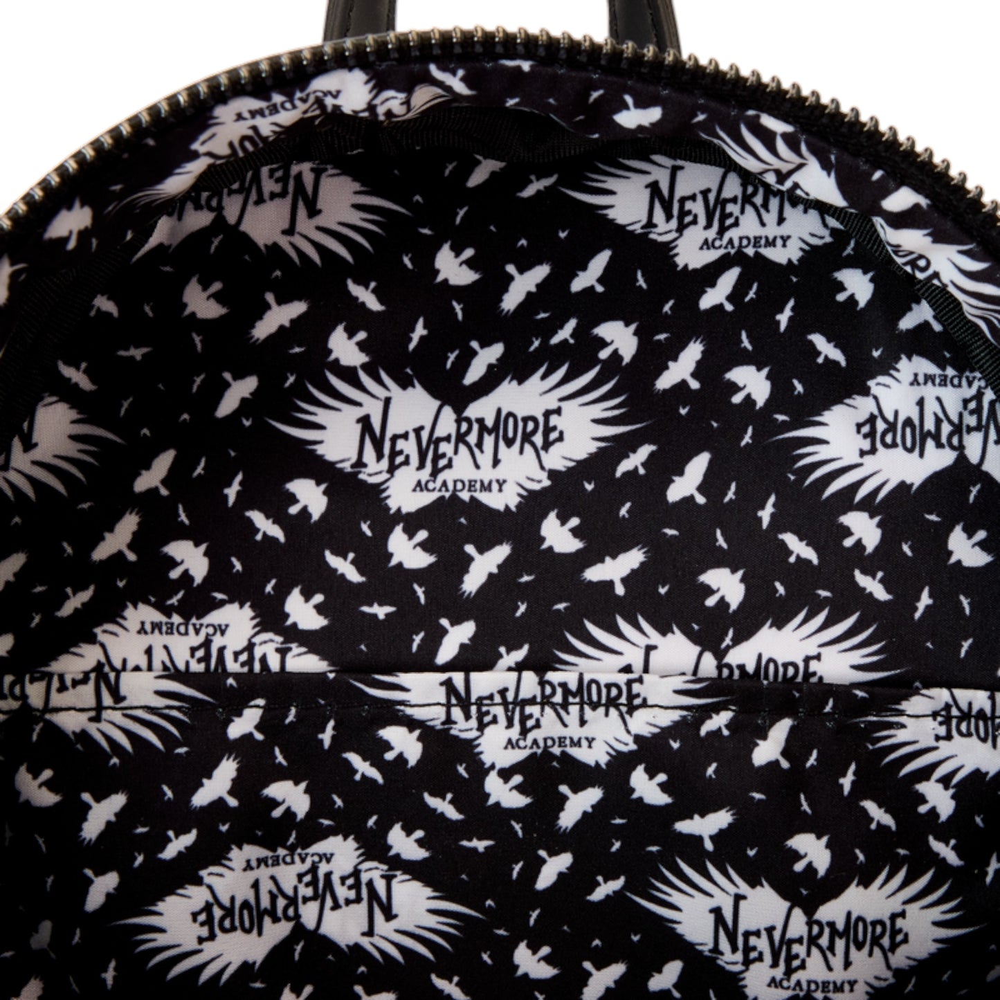 Backpack with 'Nevermore Academy' pattern on a black background