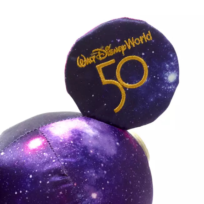 Purple plush toy with 'Walt Disney World 50' text on a white background