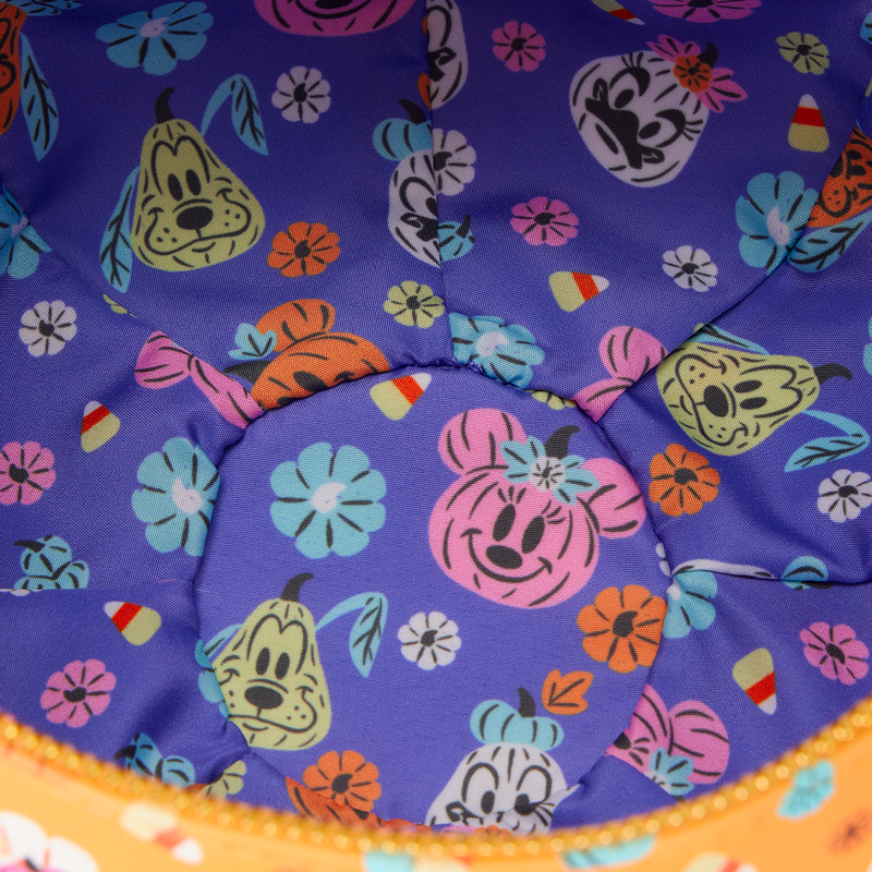 Colorful fabric with Disney themed character patterns on a purple background
