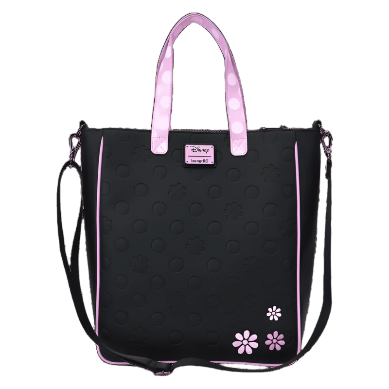 Black tote bag with pink polka dot handles and floral designs on a white background