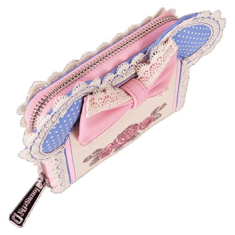 Pink and blue wallet with lace details and a bow on a white background