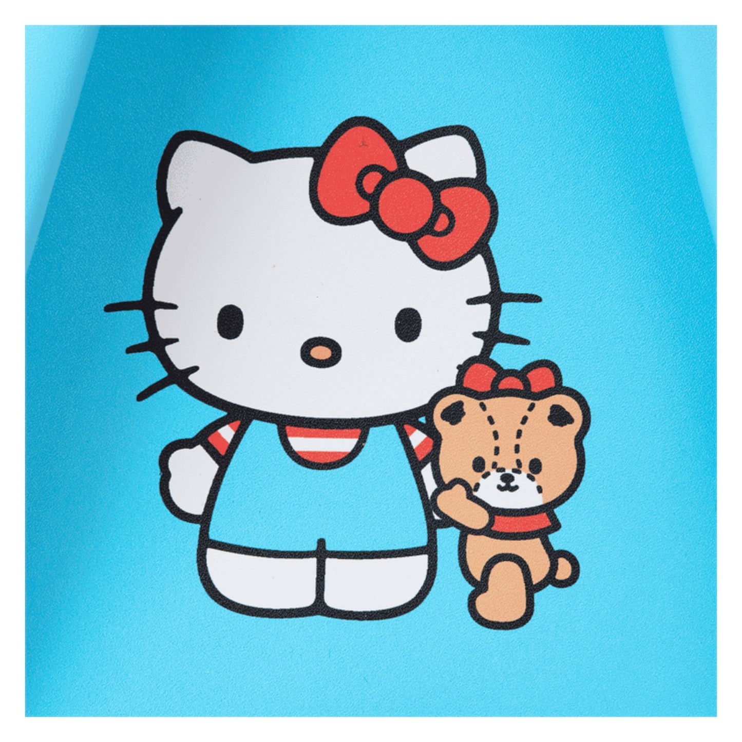 Hello Kitty with a red bow holding a teddy bear on a blue background