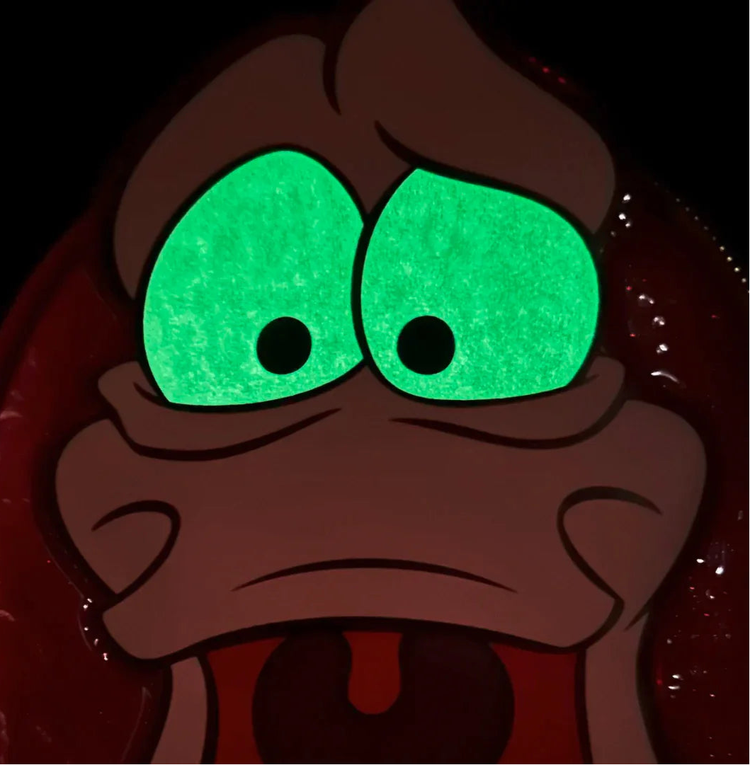 Sebastian's eyes glowing in the dark on a dark background