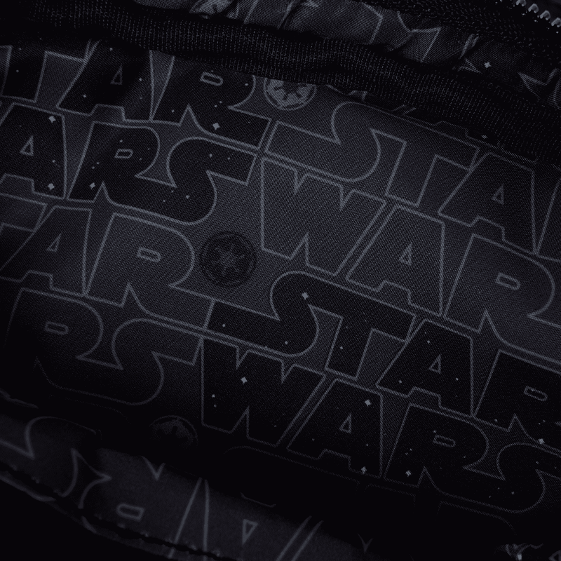 Close-up of a black Star Wars logo with repeated text pattern.