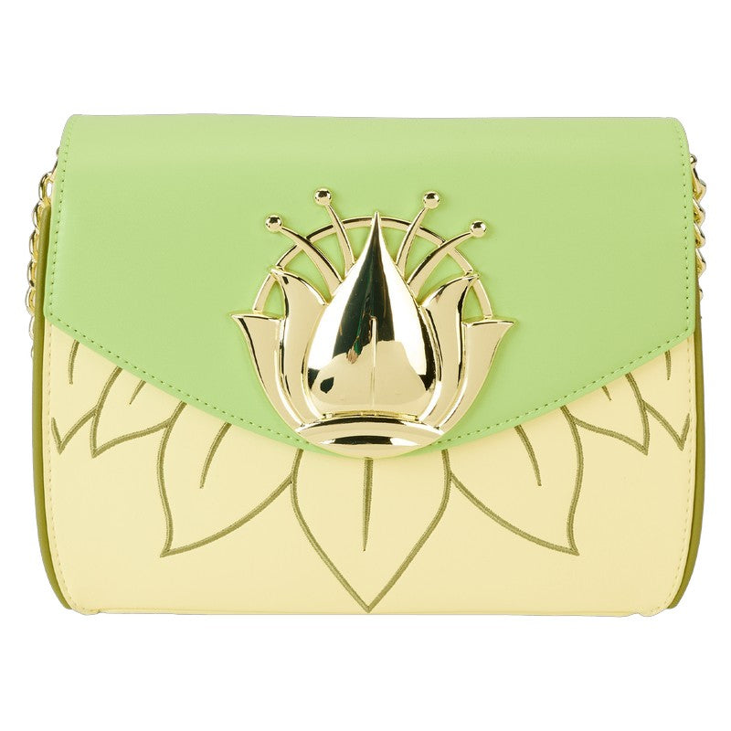 Green and yellow handbag with a gold emblem on a white background