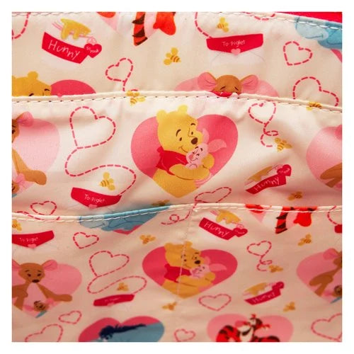 Fabric with Winnie the Pooh and heart patterns on a white background