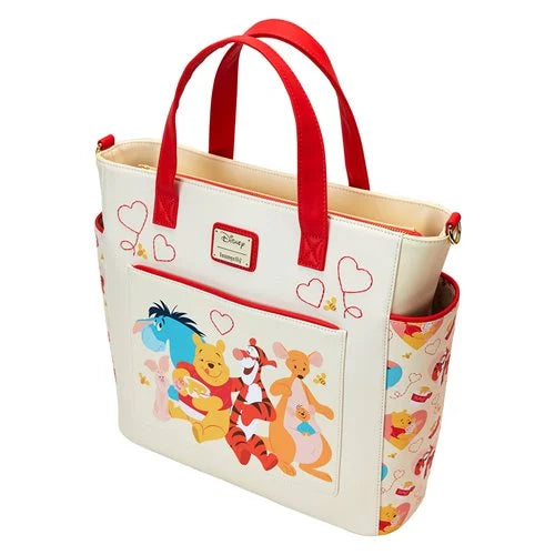 Winnie the Pooh characters tote bag with red handles on a white background