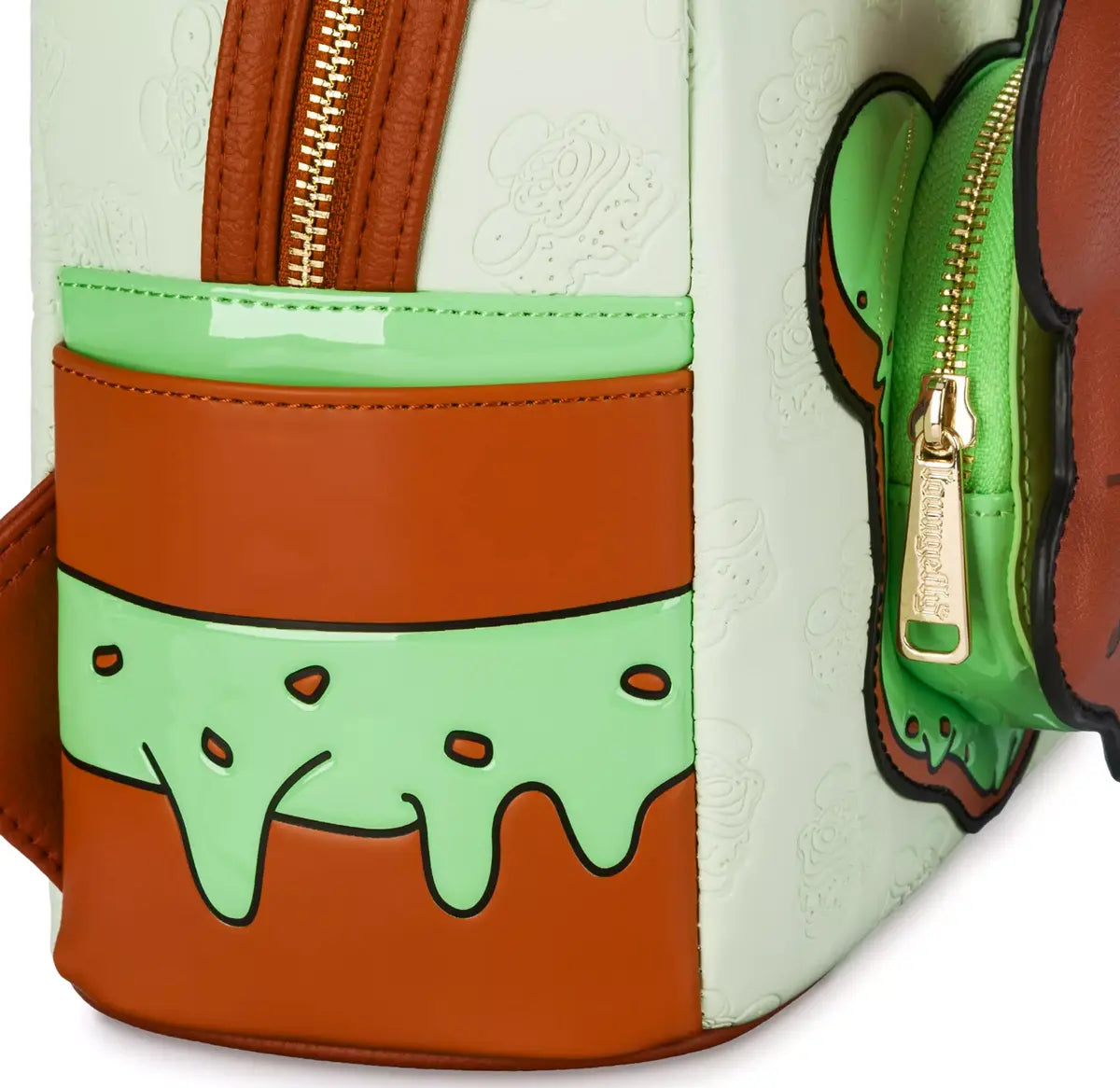 Close-up of a colorful bag with green and brown design on a white background