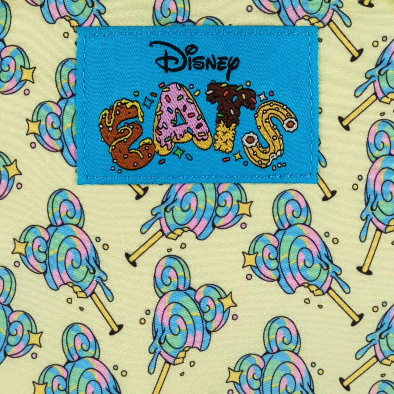 Patch with 'Disney Eats' text on a colorful candy pattern background