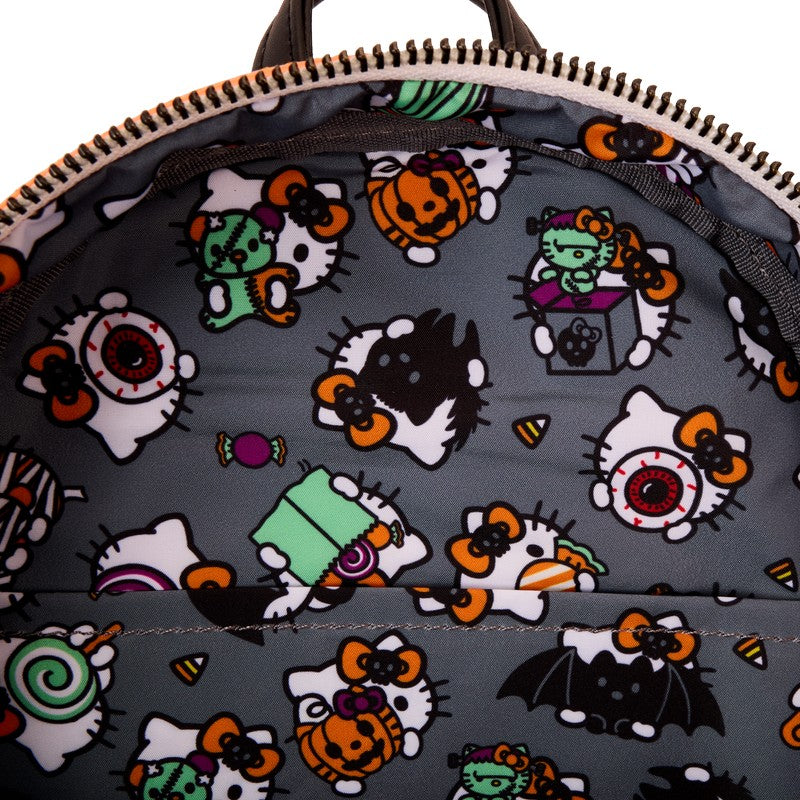 Backpack with Halloween-themed design featuring Hello Kitty characters and spooky elements on a gray background.