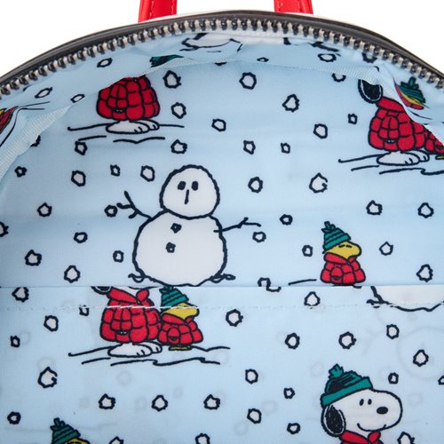 Inside view of Backpack with winter-themed design featuring snowmen and dogs in hats on a white background.