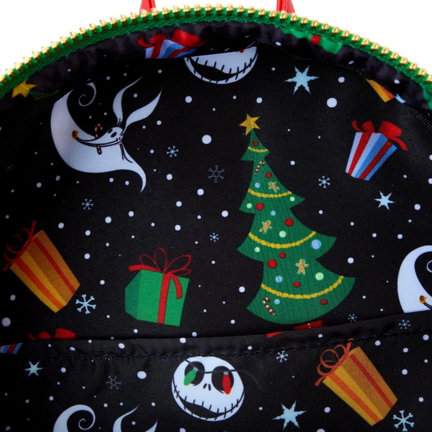 Backpack with Christmas-themed design featuring a tree, presents, and moon.