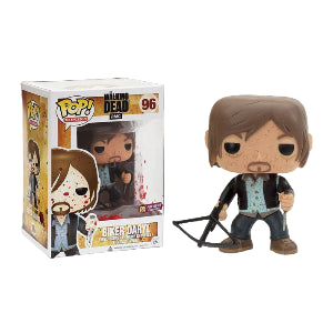 Funko Pop! vinyl figure Daryl Dixon holding a knife in one hand and a crossbow in the other from 'The Walking Dead' next to its packaging on a white background