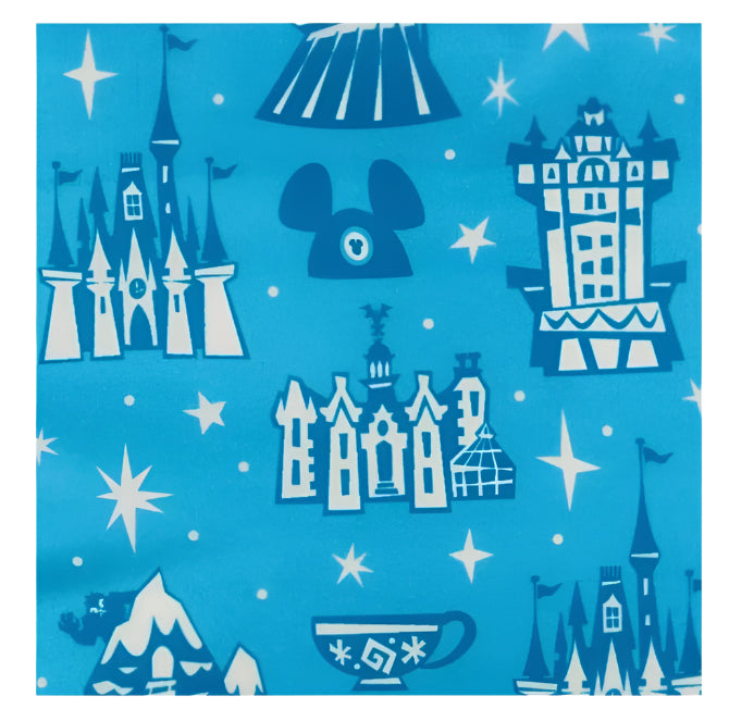 Pattern of Disney castle silhouettes and Mickey Mouse ears on a blue background with stars.