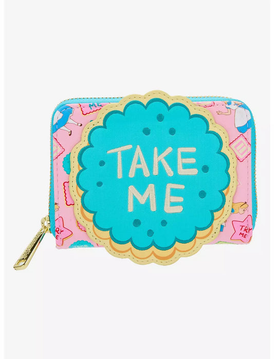 Cookie-shaped purse with 'Take Me' text on a pink background