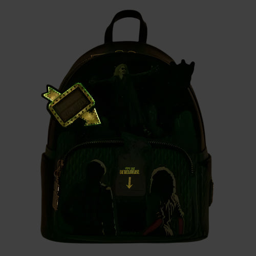 Glow in the dark backpack with embroidered designs on a dark background