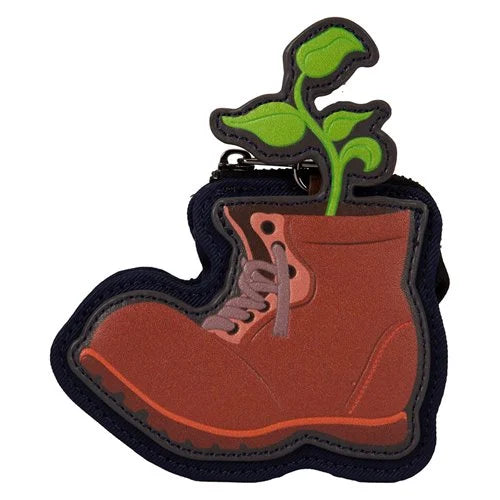 Keychain in the shape of a boot with a sprouting seedling on a white background