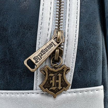 Close-up of a Harry Potter-themed zipper pull on a bag with a dark blue and white design.