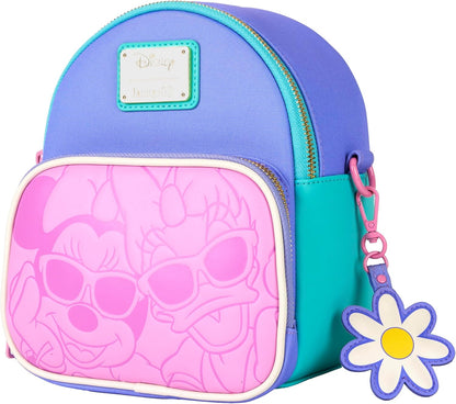 Colorful backpack with Minnie Mouse and Daisy Duck and flower charm on a white background slanted to the side
