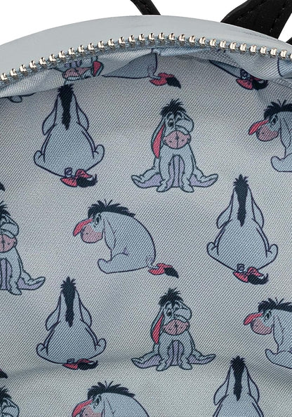 Backpack with Eeyore pattern on a light gray background