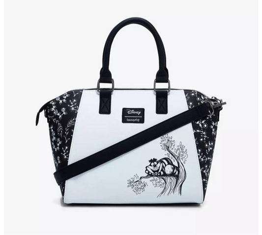 Handbag with black floral pattern and Cheshire Cat design on a white background