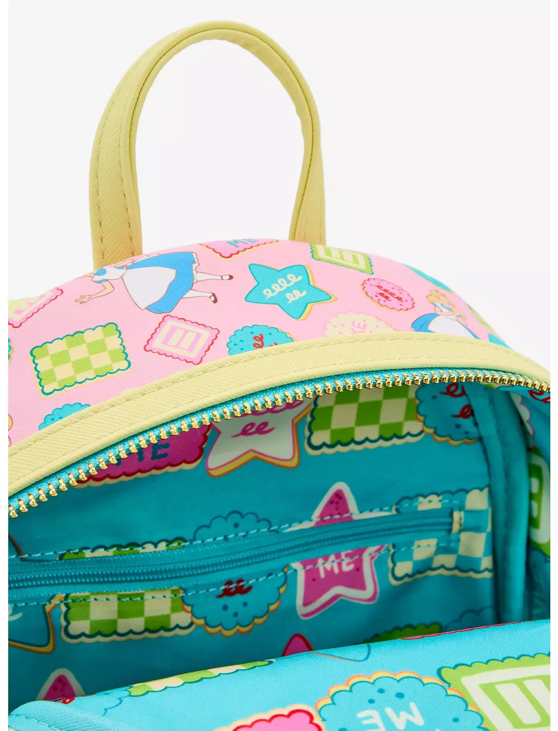 Inside of backpack lining with Alice in Wonderland characters and objects on a white background