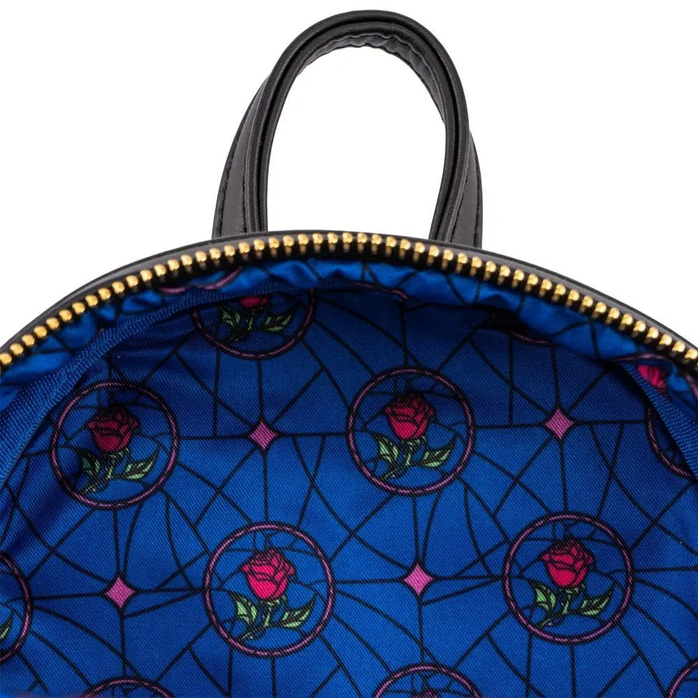 Blue bag with rose pattern and gold zipper on a white background
