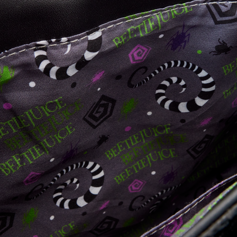 Inside view and close-up of a fabric with 'Beetlejuice' text and sandworm patterns on a dark background.