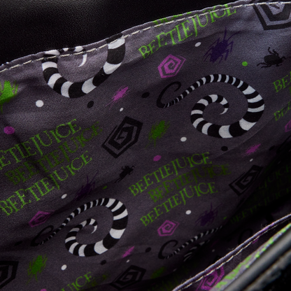 Inside view and close-up of a fabric with 'Beetlejuice' text and sandworm patterns on a dark background.