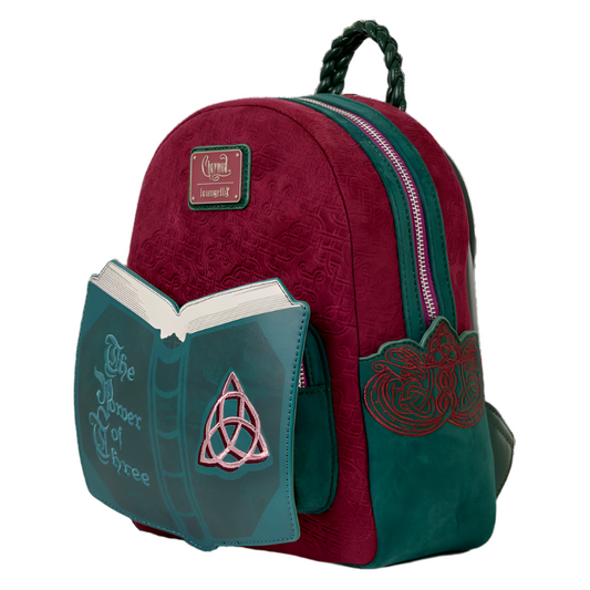 Red and green backpack with book design and 'Charm' label on a white background