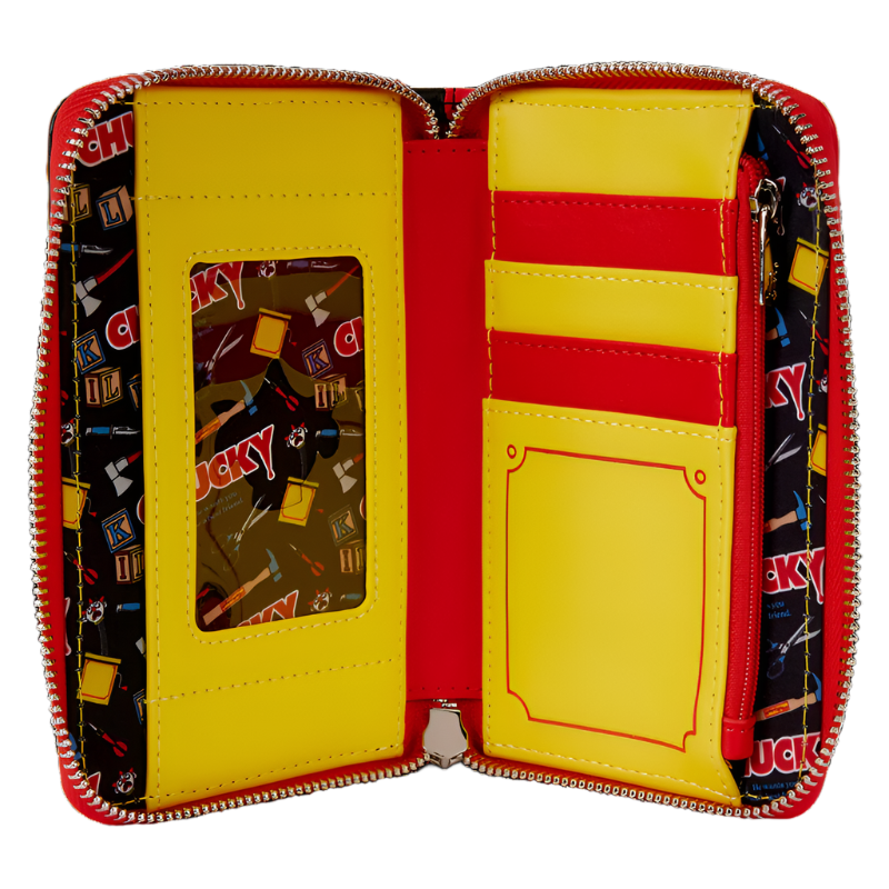 Open wallet with yellow interior and red exterior, featuring a Chucky-themed pattern on the zipper.