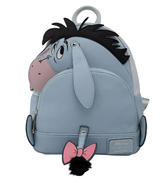 Backpack designed like Eeyore from Winnie the Pooh with a pink bow and black hair on a white background
