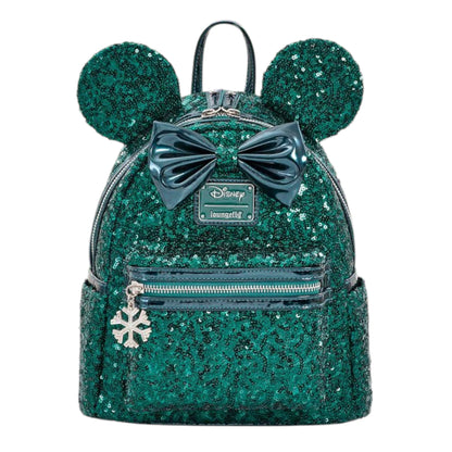 Green sequin backpack with Minnie Mouse ears, a bow, and snowflake zipper charm on a white background
