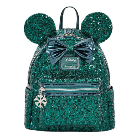 Green sequin backpack with Minnie Mouse ears, a bow, and snowflake zipper charm on a white background