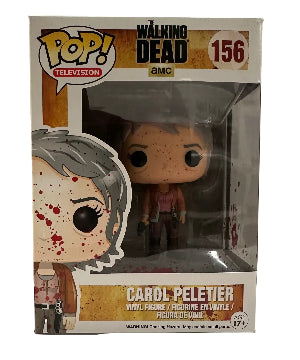 Funko Pop! vinyl figure bloody Carol Peletier holding a gun from 'The Walking Dead' in her packaging on a white background