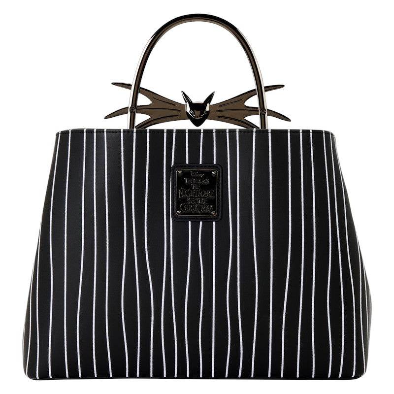 Black and white striped handbag with a Jack Skellington bat design on the handle against a white background