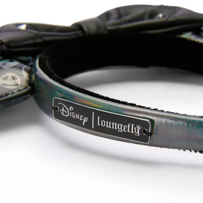 Close-up of a Disney Loungefly product with a label on a white background