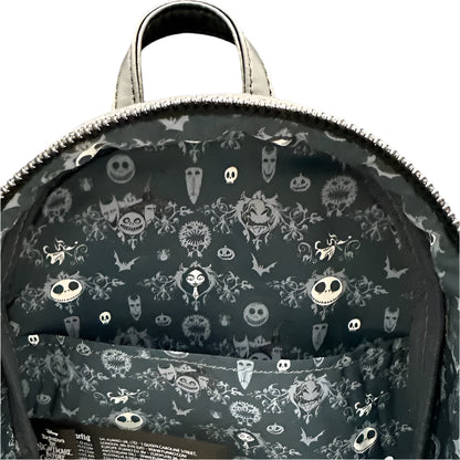 Backpack with Halloween-themed design on a dark background