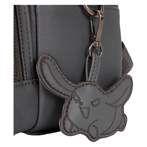 Gray dog-shaped (Wanmi Kuromi's dog) keychain attached to a gray backpack