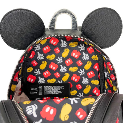 Mini backpack with Mickey Mouse ears and patterned design on a white background