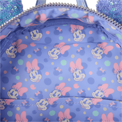 Close-up of a blue backpack with Minnie Mouse pattern on a white background