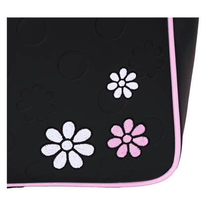 Black mat with white and pink floral designs on a white background